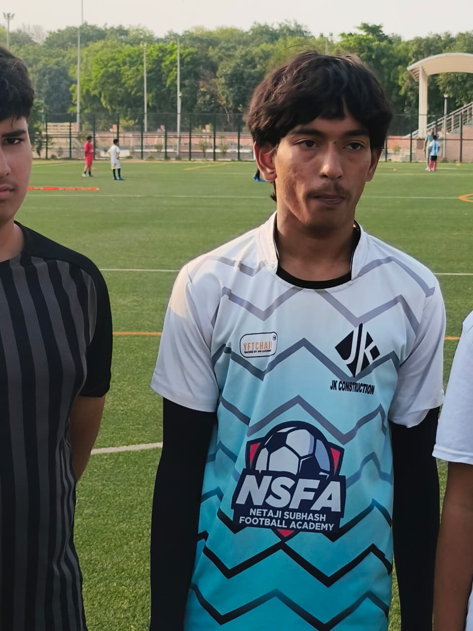 Academy player in match kit on the field