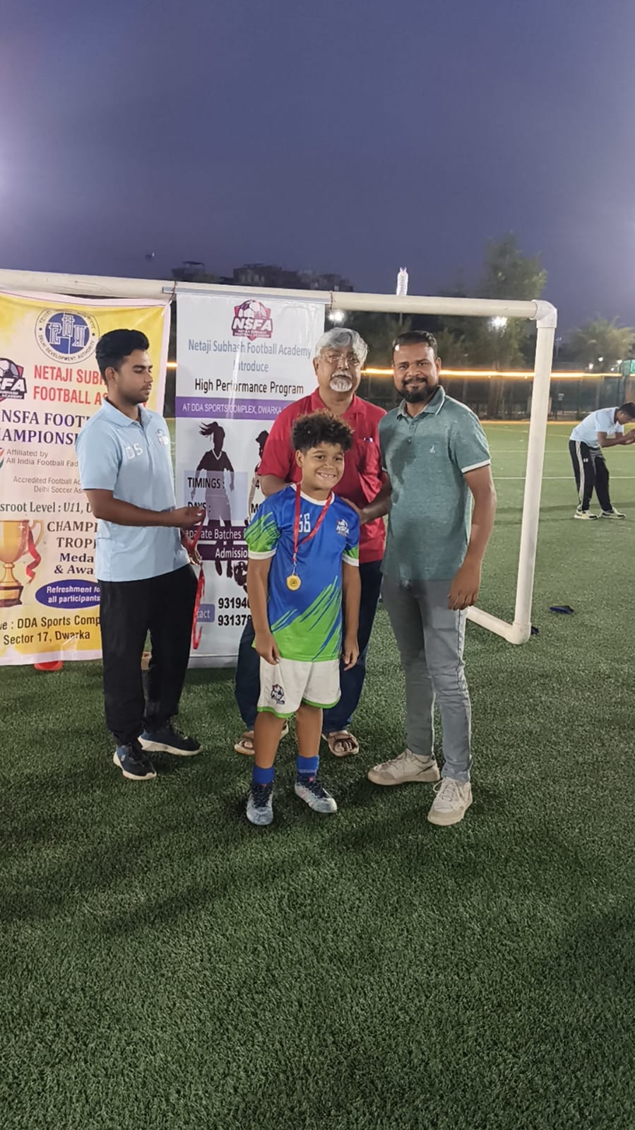 Young champion receiving his medal at the tournament
