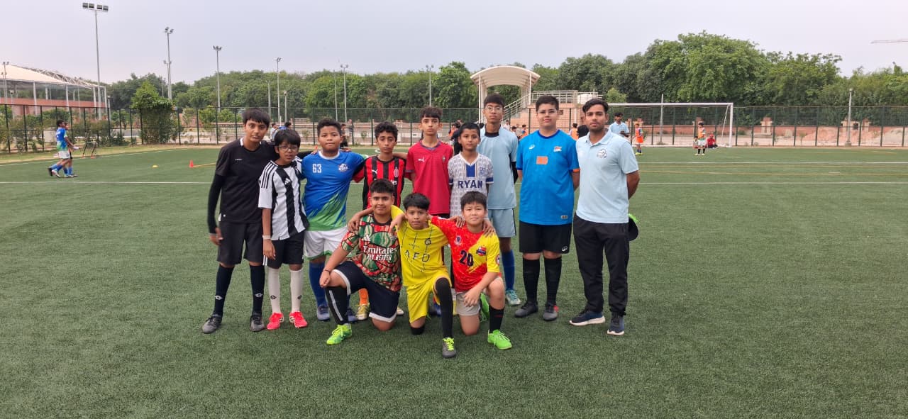 Academy squad group photo on the turf