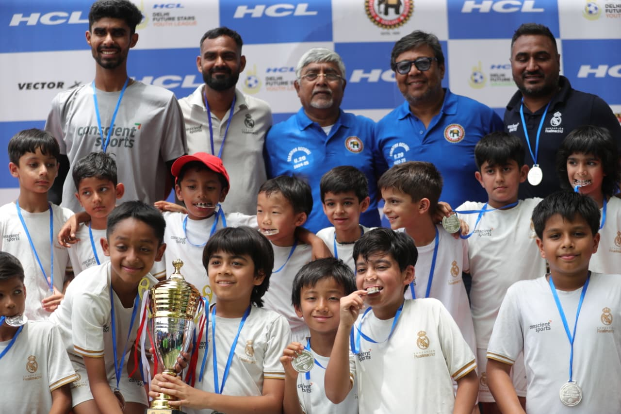 Young achievers displaying their tournament medals and winners certificates